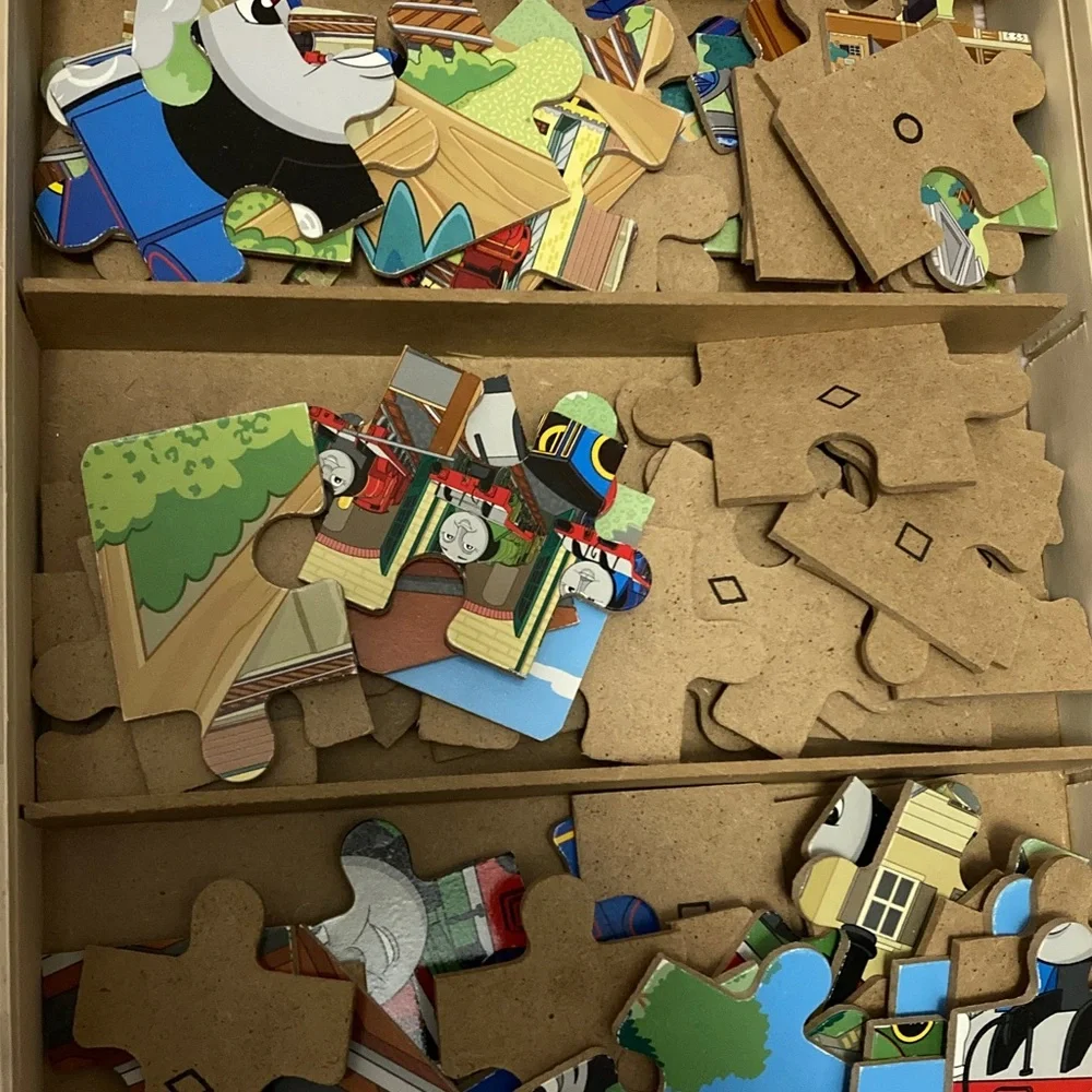 Children’s puzzles in wooden boxes